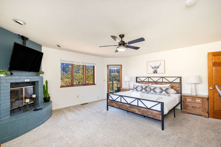Master Bedroom – King bed with decorative fireplace, private patio access, panoramic windows and smart TV. Master Bedroom – King bed with decorative fireplace, private patio access, panoramic windows and smart TV.