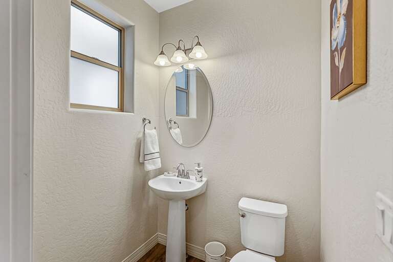1st Floor - Half Bathroom: Perfect for additional guests. 1st Floor - Half Bathroom: Perfect for additional guests.