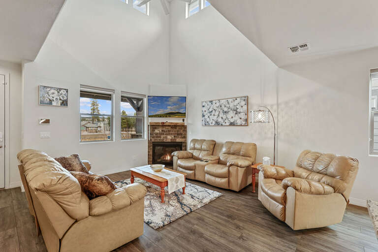 2 leather sofas and a leather lounge chair surrounding a lovely wooden coffee table. A smart, flat screen TV with HD antenna rests above the gas fireplace 2 leather sofas and a leather lounge chair surrounding a lovely wooden coffee table. A smart, flat screen TV with HD antenna rests above the gas fireplace