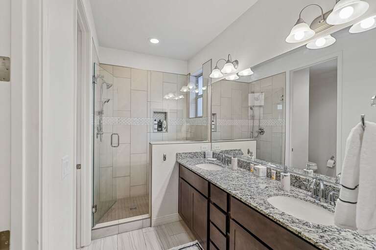 master bedroom and an ensuite bathroom with beautiful granite countertops master bedroom and an ensuite bathroom with beautiful granite countertops