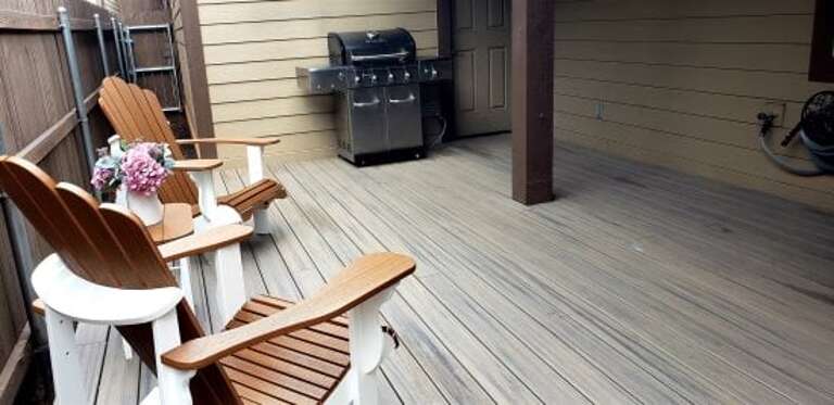 A private backyard holds a brand-new, barbecue grill A private backyard holds a brand-new, barbecue grill