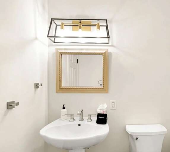 Convenient half bath located near the main living areas, perfect for guests and entertaining.