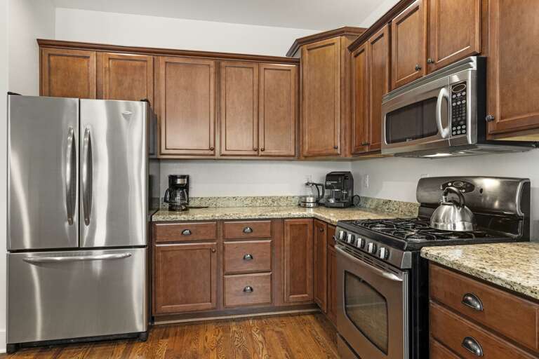 Fully stocked kitchen with cookware and utensils Fully stocked kitchen with cookware and utensils