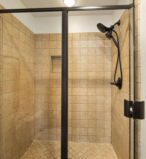 Master Bedroom – King bed, walk-in closet, TV, and spa-like ensuite bathroom with dual sinks, oversized tub, and walk-in shower. Master Bedroom – King bed, walk-in closet, TV, and spa-like ensuite bathroom with dual sinks, oversized tub, and walk-in shower.