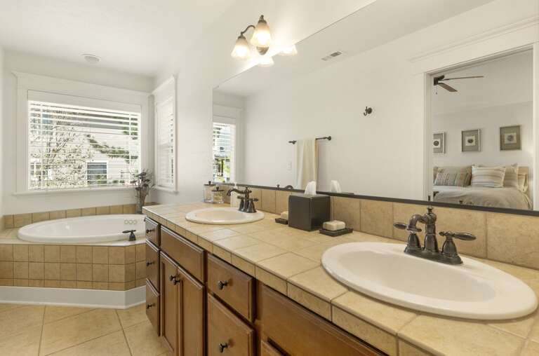 Master Bedroom – King bed, walk-in closet, TV, and spa-like ensuite bathroom with dual sinks, oversized tub, and walk-in shower. Master Bedroom – King bed, walk-in closet, TV, and spa-like ensuite bathroom with dual sinks, oversized tub, and walk-in shower.