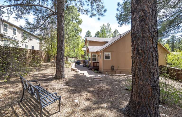 Outdoor Paradise – Fenced backyard with a cozy deck seating and BBQ grill, plus charming front porch. Outdoor Paradise – Fenced backyard with a cozy deck seating and BBQ grill, plus charming front porch.