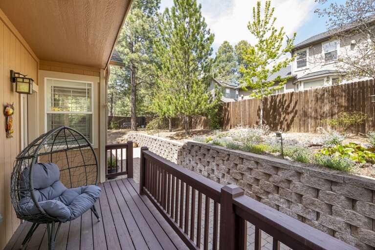 Step into the serene, fenced backyard offering privacy and tranquility. A door from the family room opens to a cozy deck with seating, perfect for relaxing or hosting. Step into the serene, fenced backyard offering privacy and tranquility. A door from the family room opens to a cozy deck with seating, perfect for relaxing or hosting.