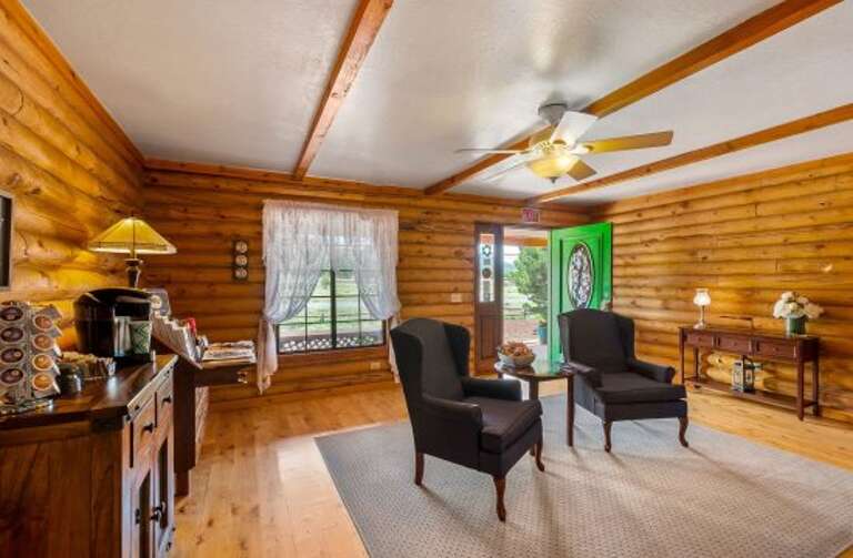 Unwind in one of the cozy seating areas, enjoy complimentary snacks and beverages, or settle into a plush chair by the grand stone fireplace. Unwind in one of the cozy seating areas, enjoy complimentary snacks and beverages, or settle into a plush chair by the grand stone fireplace.