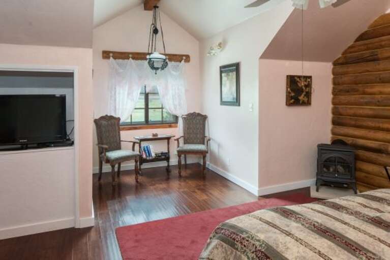 Fourth Bedroom: This elegant room includes a King-sized bed, faux-painted walls, and a bathroom with a claw-foot tub and separate walk-in shower for a spa-like feel.