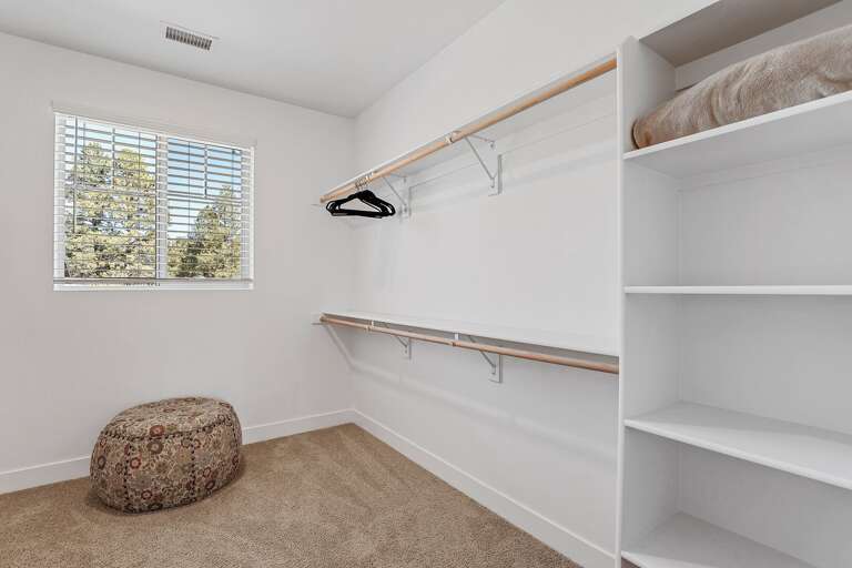 2nd Floor - Master Bedroom: King bed, smart TV, en-suite bath with dual vanities, glass shower, and walk-in closet 2nd Floor - Master Bedroom: King bed, smart TV, en-suite bath with dual vanities, glass shower, and walk-in closet