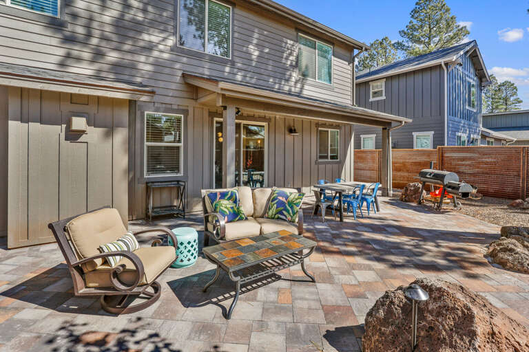 Completely enclosed for privacy, this beautiful outdoor space is equipped with a recessed gas firepit, a propane barbecue grill, and plenty of seating. Completely enclosed for privacy, this beautiful outdoor space is equipped with a recessed gas firepit, a propane barbecue grill, and plenty of seating.