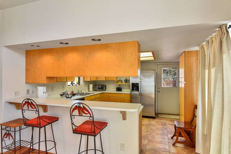 For more casual dining, there's also a kitchen counter bar that seats two. For more casual dining, there's also a kitchen counter bar that seats two.