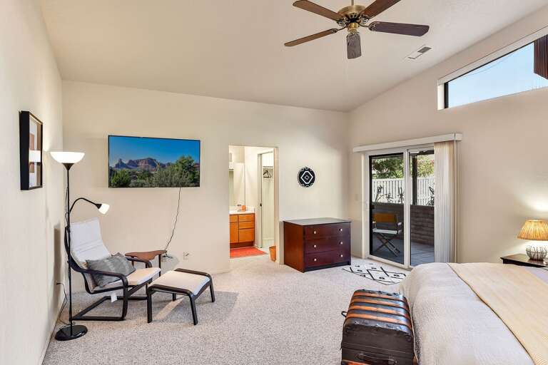 Master Suite: Features a king-size bed, Smart TV, comfy chair with ottoman, and an en suite with Master Suite: Features a king-size bed, Smart TV, comfy chair with ottoman, and an en suite with