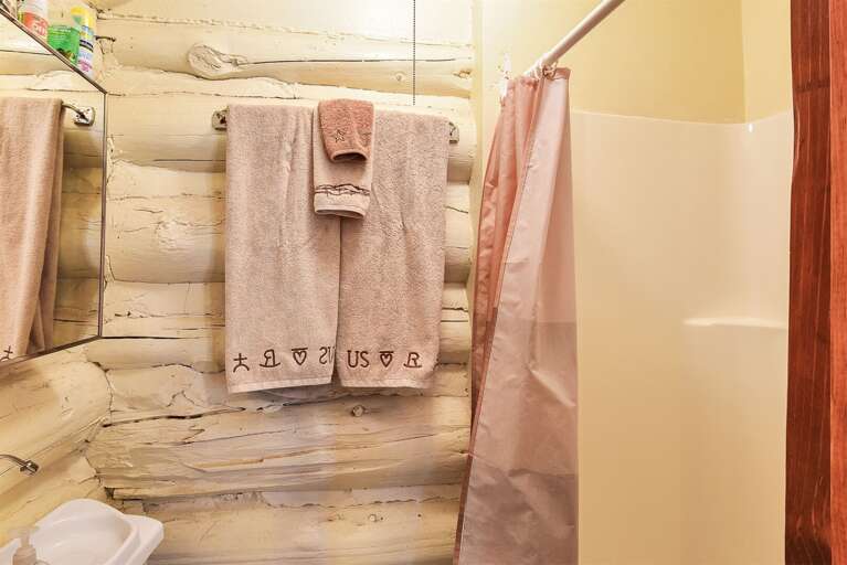 Bathroom: New shower/tub combo, vanity, and toilet.