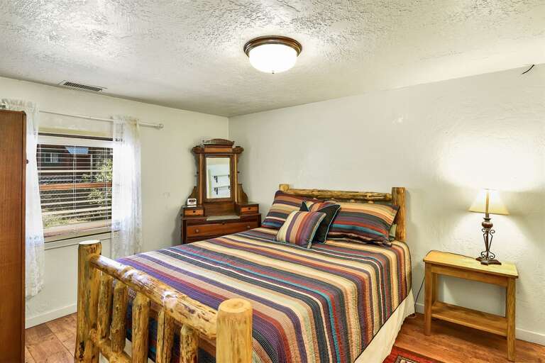 Bedroom 2: Queen bed with authentic rustic decor