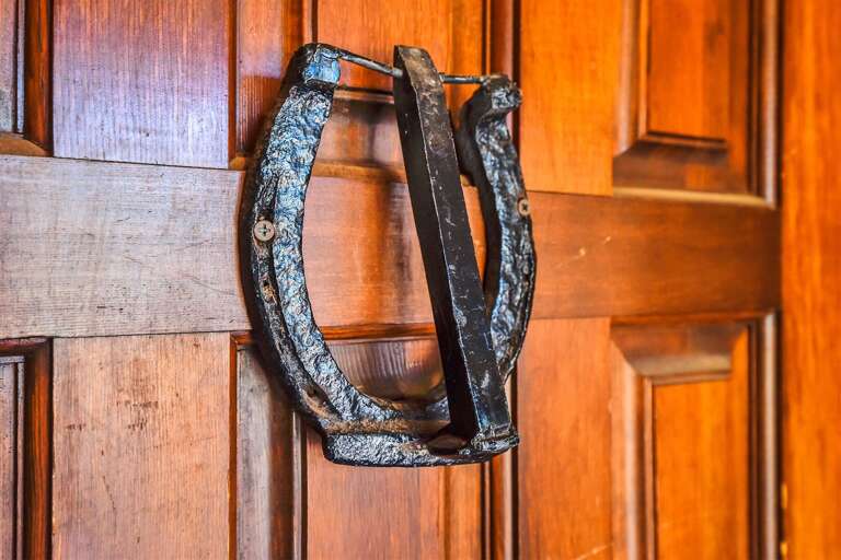Covered porch with old-timey rocking chairs, perfect for sittin' and soakin' in the cowboy life
