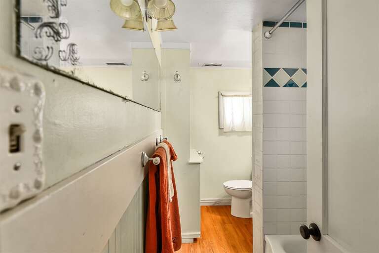 Shared Bathroom is thoughtfully designed with all essentials  and tub/shower combo