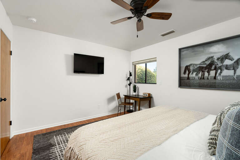 Bedroom 2: Stylishly appointed with a king-size bed, this room includes a dedicated workspace and access to a shared full bathroom, perfect for productivity and relaxation. Bedroom 2: Stylishly appointed with a king-size bed, this room includes a dedicated workspace and access to a shared full bathroom, perfect for productivity and relaxation.