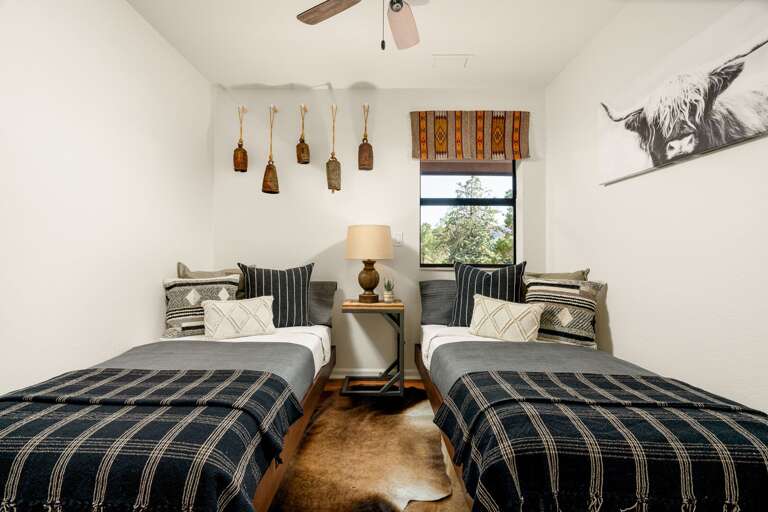 Bedroom 3: Designed with charm and versatility, this room offers two twin beds with plush bedding and eclectic accents, ideal for children or additional guests. Bedroom 3: Designed with charm and versatility, this room offers two twin beds with plush bedding and eclectic accents, ideal for children or additional guests.