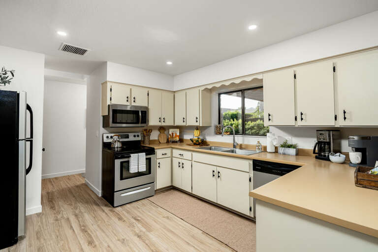 Whether you're planning to cook a full gourmet meal or just need a quick snack, our kitchen is designed to meet all your needs with ample counter space and modern appliances. Whether you're planning to cook a full gourmet meal or just need a quick snack, our kitchen is designed to meet all your needs with ample counter space and modern appliances.