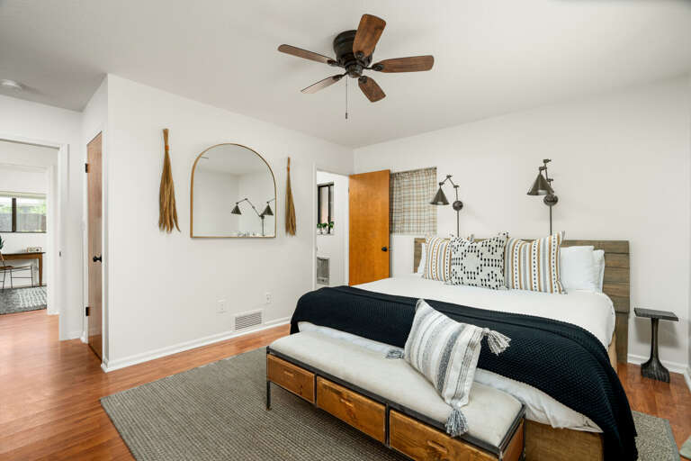 Primary Suite: Experience ultimate comfort with a king-size bed adorned in luxury linens, a smart TV for entertainment Primary Suite: Experience ultimate comfort with a king-size bed adorned in luxury linens, a smart TV for entertainment