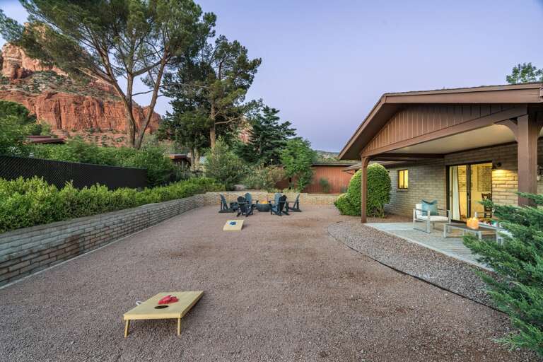 Spacious yard for yard games!  Spend your evenings stargazing around a gas firepit with 6 Adirondack chairs. Spacious yard for yard games!  Spend your evenings stargazing around a gas firepit with 6 Adirondack chairs.