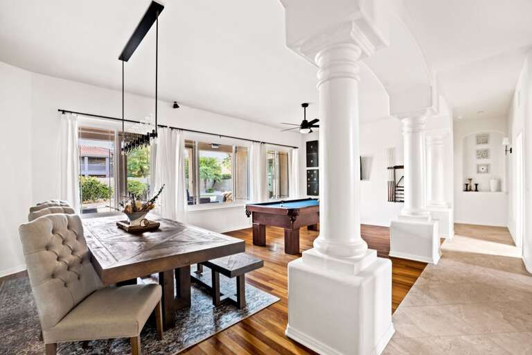 Dining Area w/ Pool Table in Background & Large Columns Dining Area w/ Pool Table in Background & Large Columns