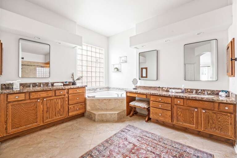 Main Suite Bathroom w/ Jetted Tub, Shower & Ample Counter Space Main Suite Bathroom w/ Jetted Tub, Shower & Ample Counter Space