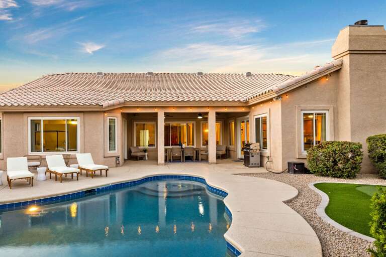 Pristine Pool w/ Outdoor Seating & Grill in Background Pristine Pool w/ Outdoor Seating & Grill in Background