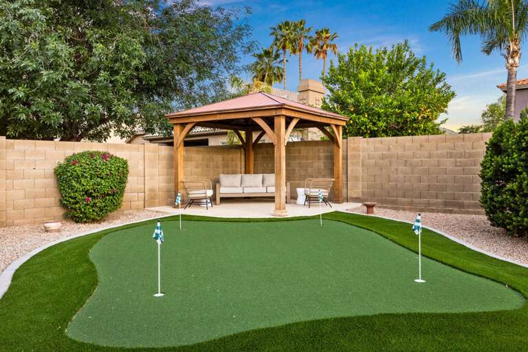Putting Green w/ Sheltered Seating in Background Putting Green w/ Sheltered Seating in Background