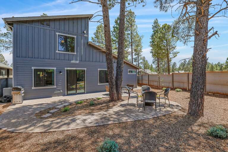 Private Backyard Oasis: Relax in the fully enclosed yard offering outdoor seating, a fire pit area, and serene views. Private Backyard Oasis: Relax in the fully enclosed yard offering outdoor seating, a fire pit area, and serene views.