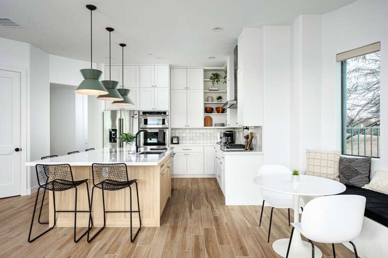 There are 5 island bar seats and a quaint breakfast nook. There are 5 island bar seats and a quaint breakfast nook.