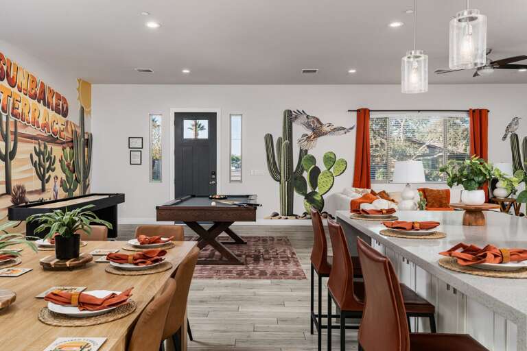Bright, Open Space with Stylish Kitchen Island, Dining Table, Cozy Living Area, and Pool Table