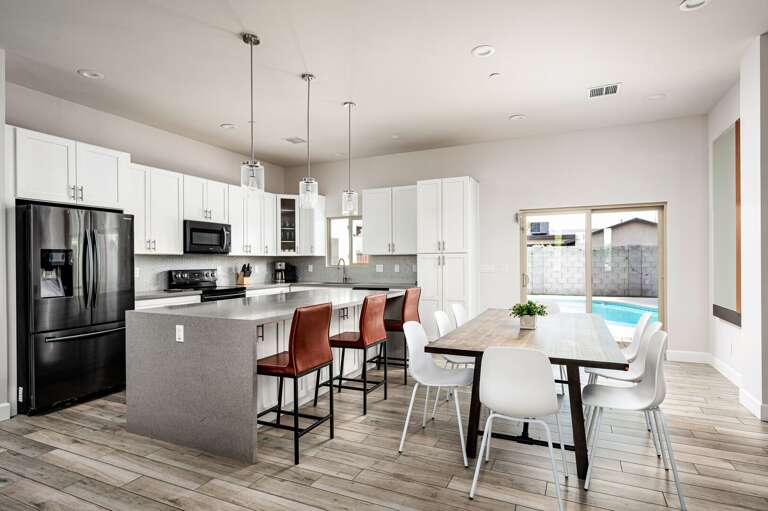 Dining table for 8 and barstool seating for 3. Dining table for 8 and barstool seating for 3.