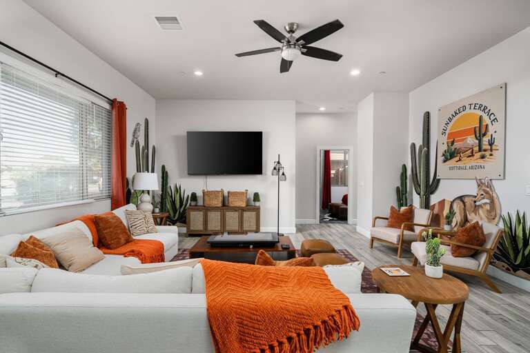 Open Living Space Featuring Modern Furnishings, Bold Pops of Color, & Desert-inspired Décor