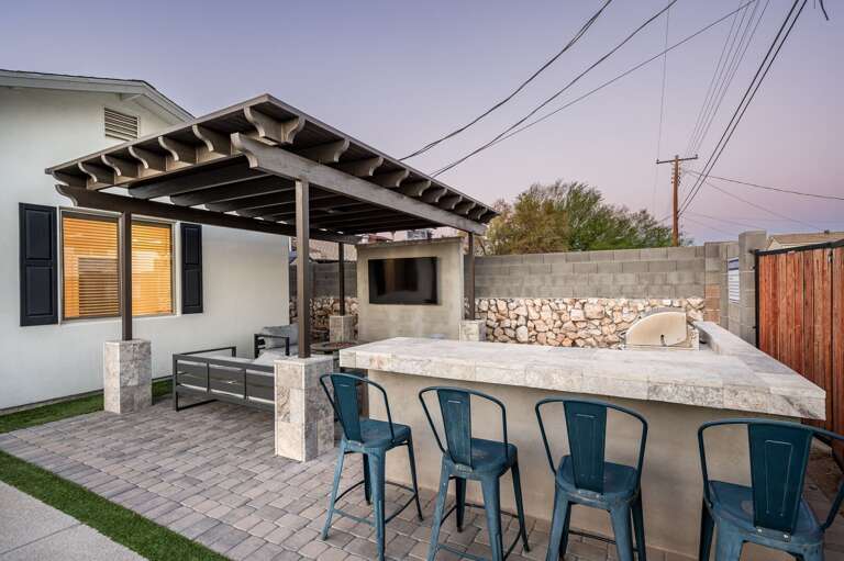 Outdoor barstool seating surrounding the BBQ. Outdoor barstool seating surrounding the BBQ.