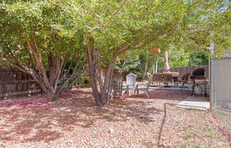 The fenced backyard is a haven for outdoor fun. The fenced backyard is a haven for outdoor fun.