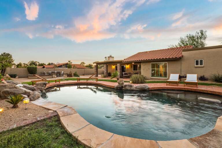 Pool Area w/ Pristine Waters & Nearby Sun Beds
