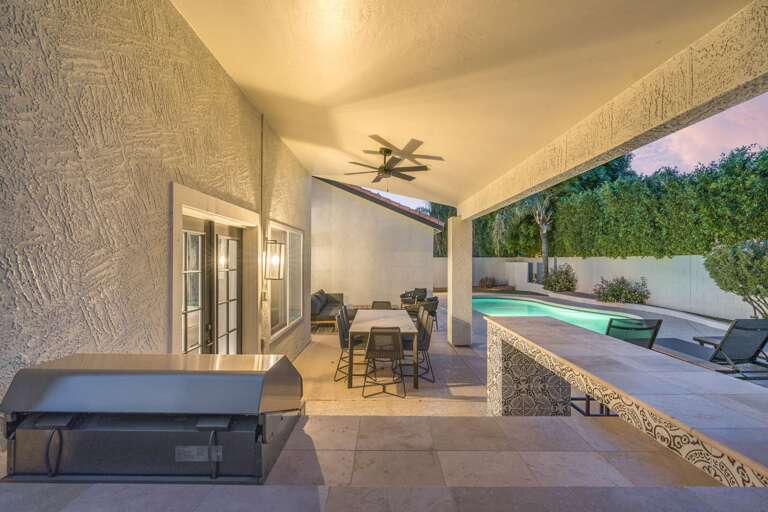 Grill Area w/ Outdoor Dining Area & Pool in Background Grill Area w/ Outdoor Dining Area & Pool in Background