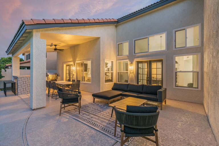 Outdoor Seating Area w/ Dining Area in Background Outdoor Seating Area w/ Dining Area in Background