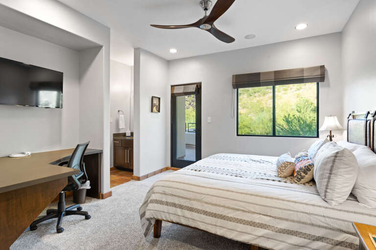 Bedroom Three w/ King Bed & Mounted TV Bedroom Three w/ King Bed & Mounted TV