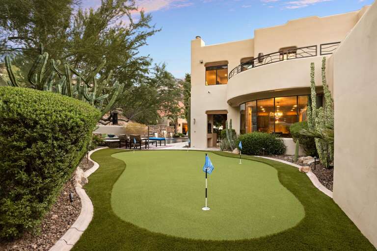 Putting Green With Pool Area in Background Putting Green With Pool Area in Background