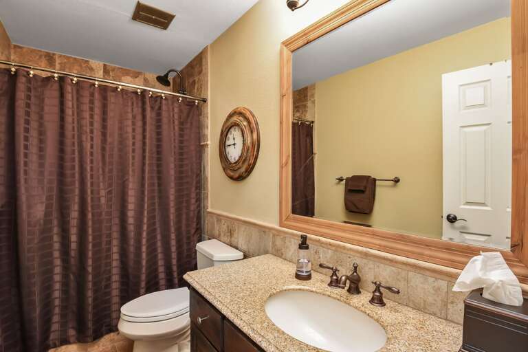 Bathroom 2 shared between the King and Bunk Room with a tub/shower combo Bathroom 2 shared between the King and Bunk Room with a tub/shower combo