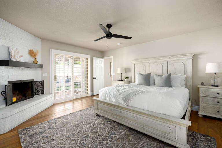 Main Suite w/ sliding doors leading to the backyard. Main Suite w/ sliding doors leading to the backyard.