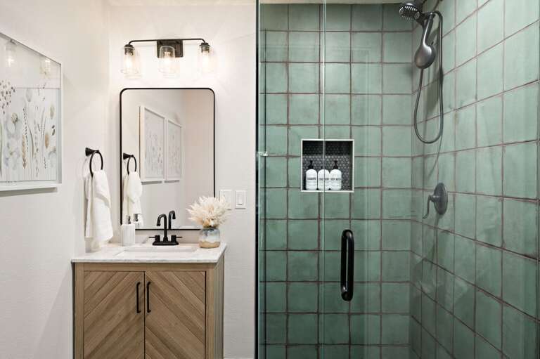 Bathroom located near garage.