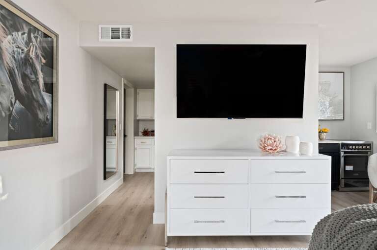 Private suite bedroom has a television...