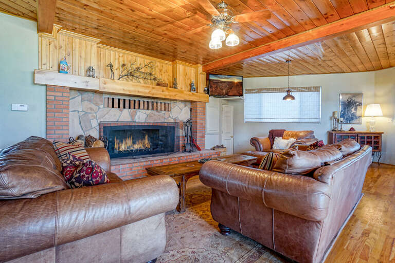 Unwind in the cozy and inviting living room, designed for relaxation and entertainment. Unwind in the cozy and inviting living room, designed for relaxation and entertainment.