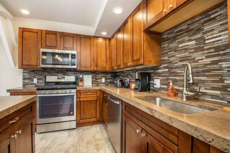 kitchen is updated with Stainless Steel Appliances kitchen is updated with Stainless Steel Appliances