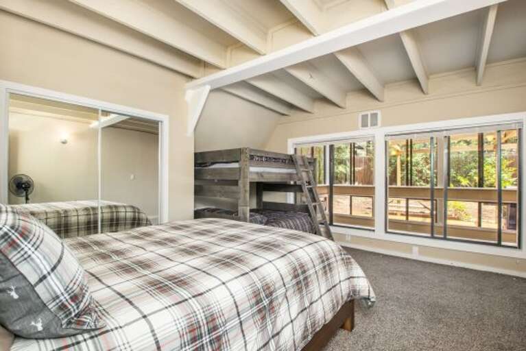 a queen bed and bunk-beds (full over full) (sleeps six) a queen bed and bunk-beds (full over full) (sleeps six)