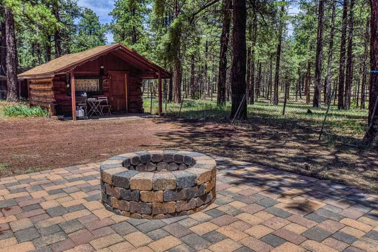 Gather around the firepit and make unforgettable memories under the stars at this charming cabin retreat.